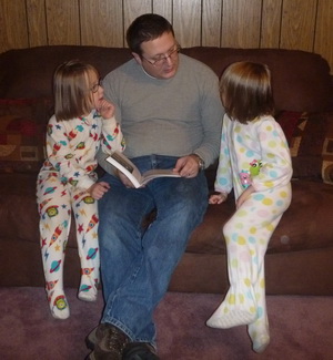 Jake reading the goat book to the girls, great Daddy