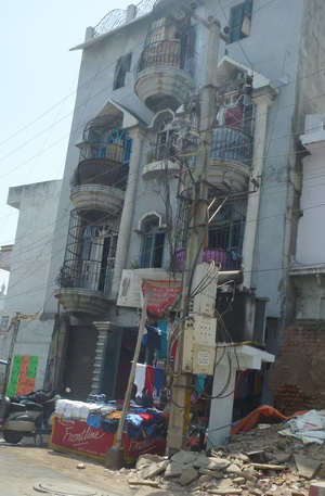 Notice the balconies and rooftop